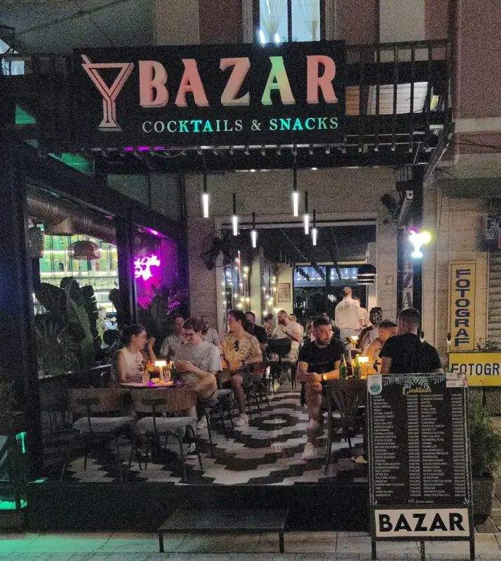 Bazar from the boulevard, under its neon sign