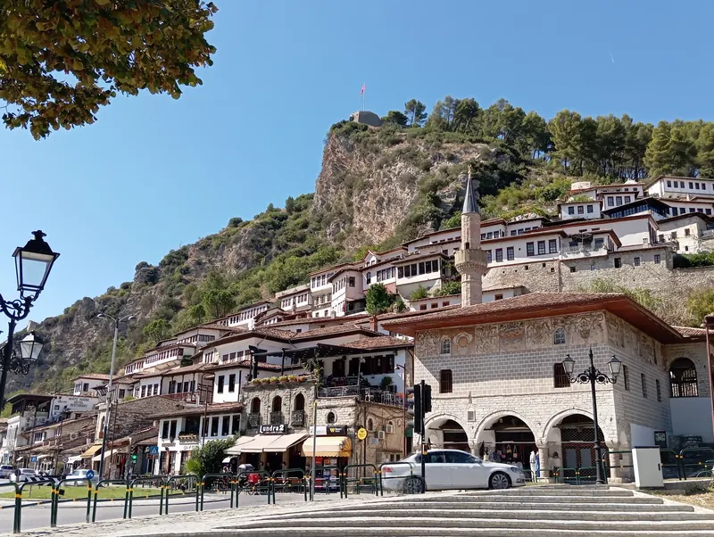 Berat's old town on the hill above the boulevard, on a sunny day
